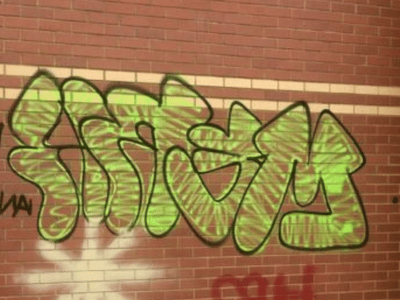 Wall with graffiti before professional removal