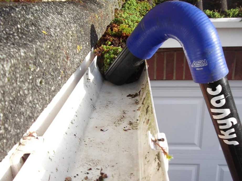 A close-up view of the same gutter after cleaning. The gutter is now clear of all debris, leaves, and dirt. It appears clean and well-maintained, allowing for proper water flow. The transformation highlights the effectiveness of the gutter cleaning process.