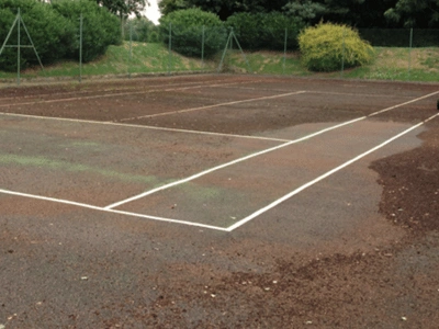 Dirty tennis court before professional cleaning