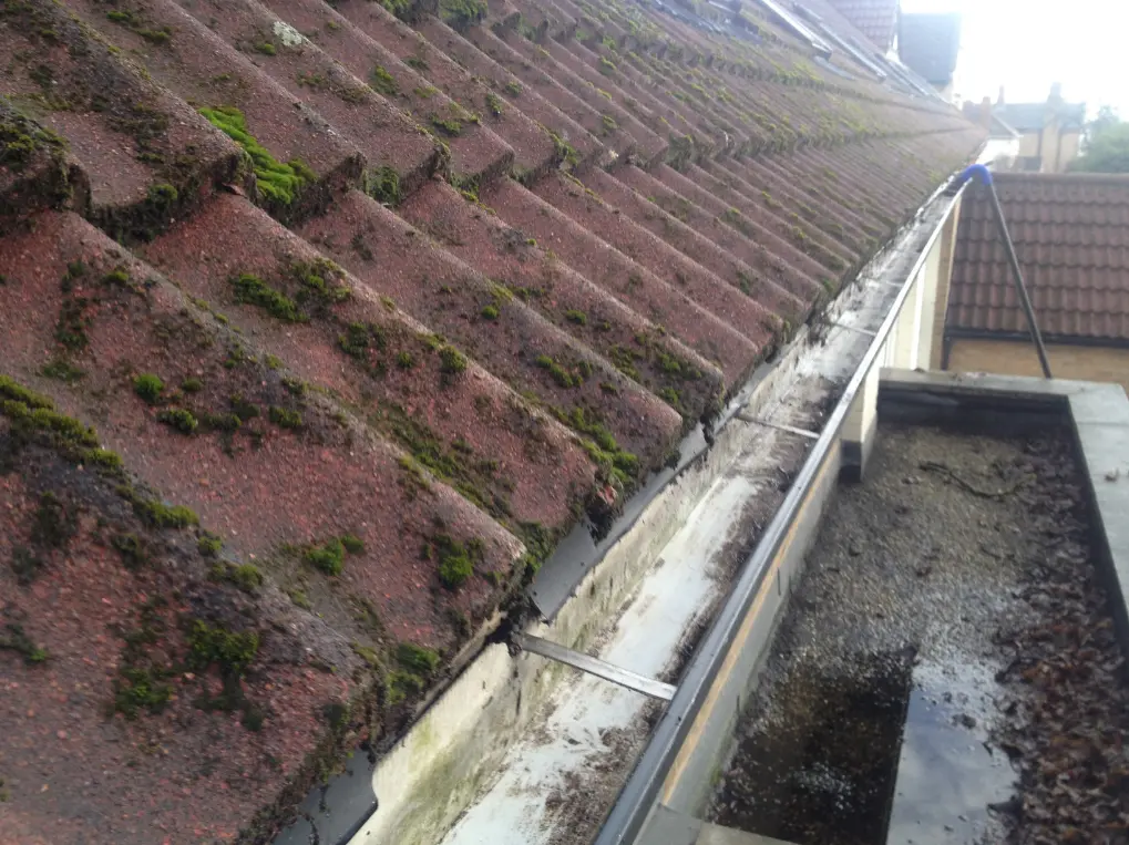 A close-up view of the same gutter after cleaning. The gutter is now clear of all debris, leaves, and dirt. It appears clean and well-maintained, allowing for proper water flow. The transformation highlights the effectiveness of the gutter cleaning process.