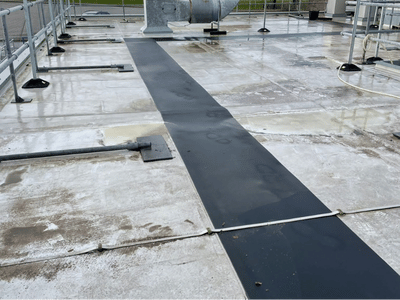 commercial unit showcasing a before clean industrial unit roof clean service